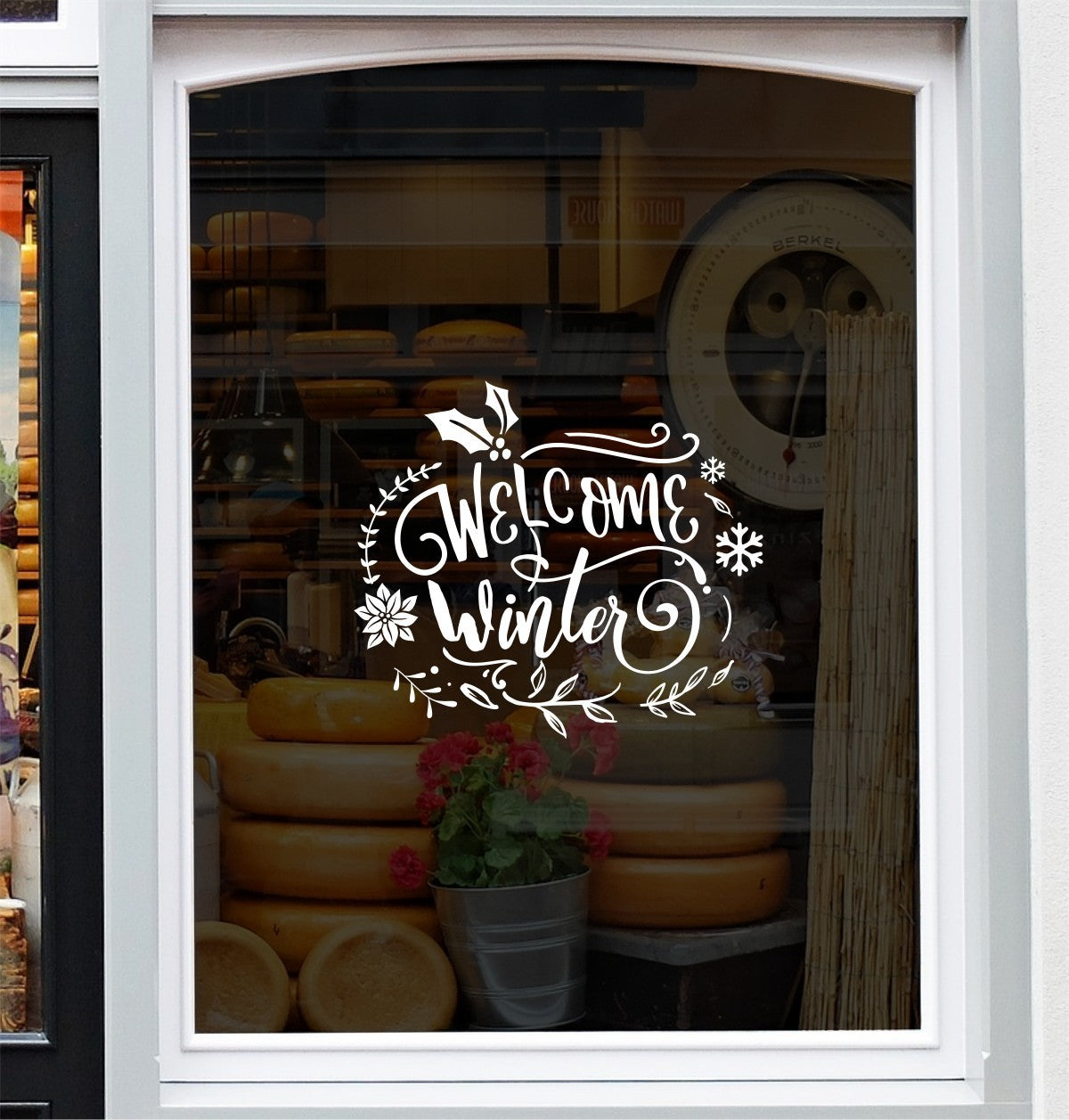 White Welcome Winter festive vinyl decal on a window