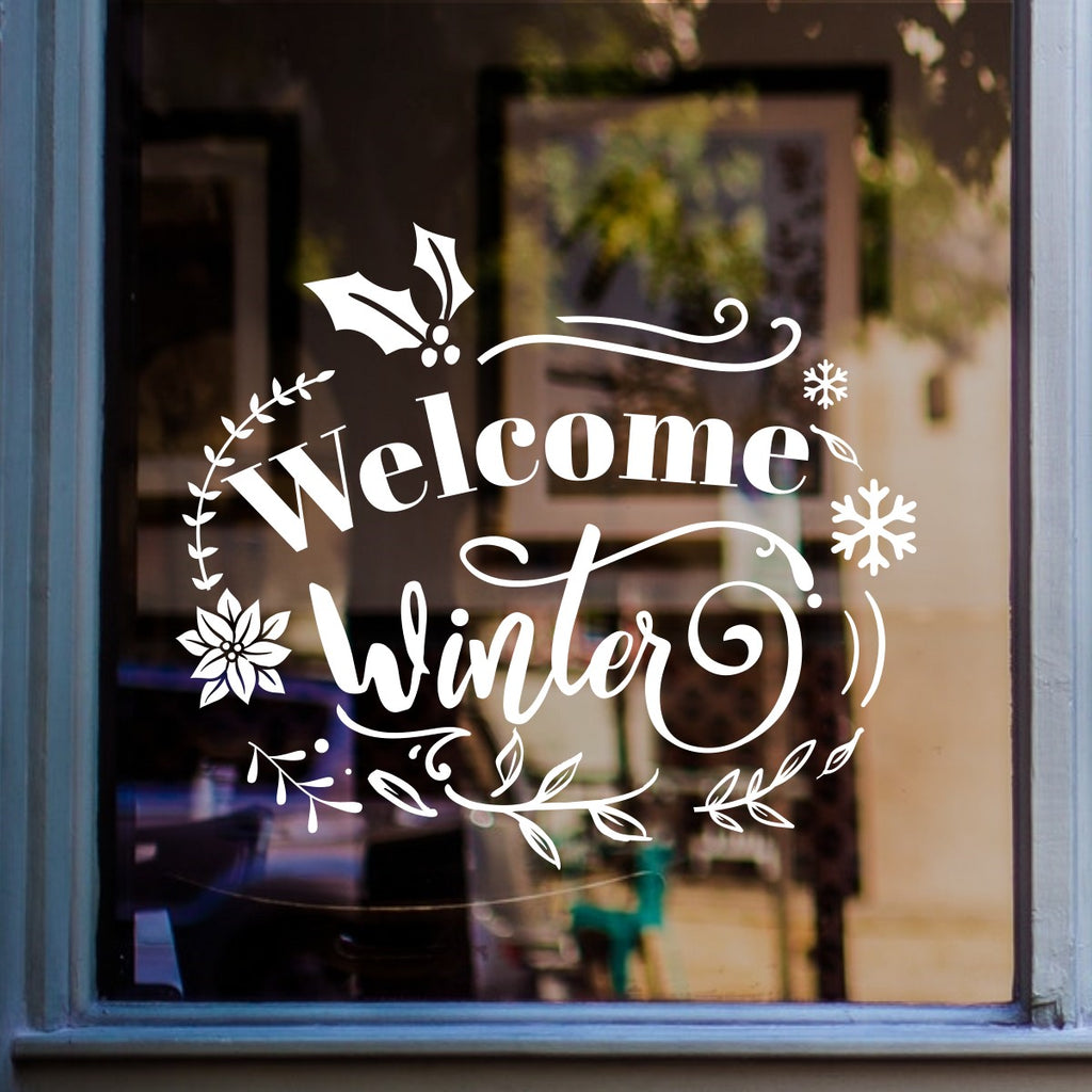 White Welcome Winter vinyl sticker displayed on a shop window