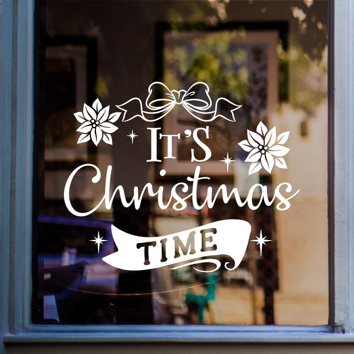 White It's Christmas Time vinyl sticker displayed on a shop window