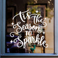 White Tis The Season To Sparkle Christmas window decal on a shop window